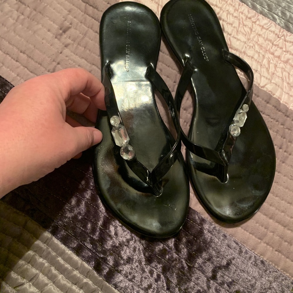Black flat flip flops